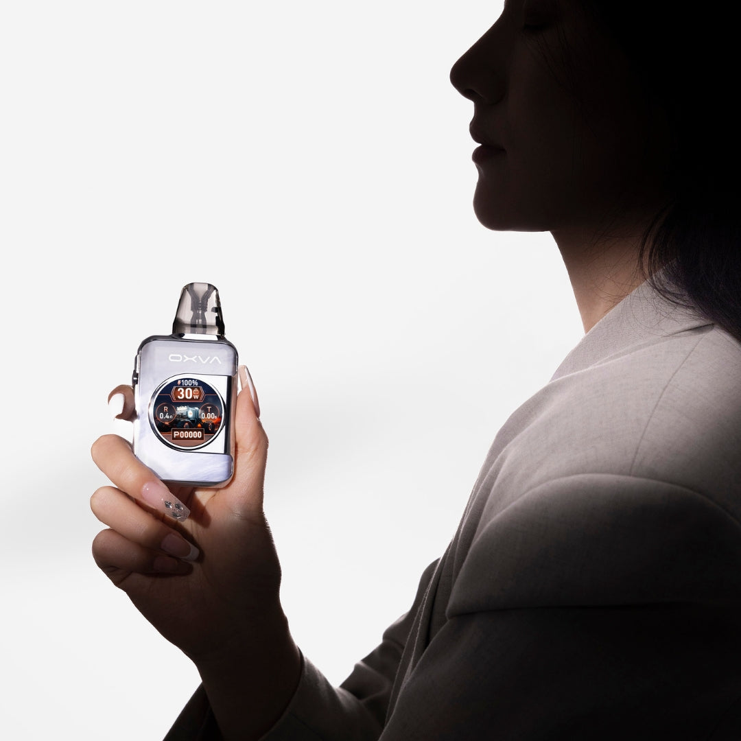 a woman holding the oxva xlim sq pro 2 pod vape kit